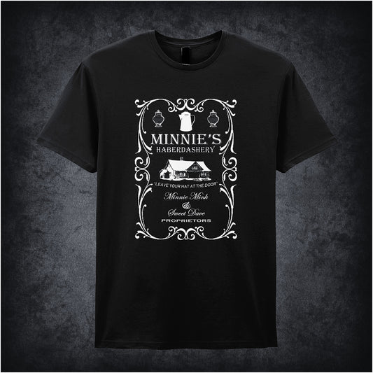 black unisex T-shirt featuring “Minnie's Haberdashery” design inspired by The Hateful Eight, with vintage-style lettering and rustic aesthetic.