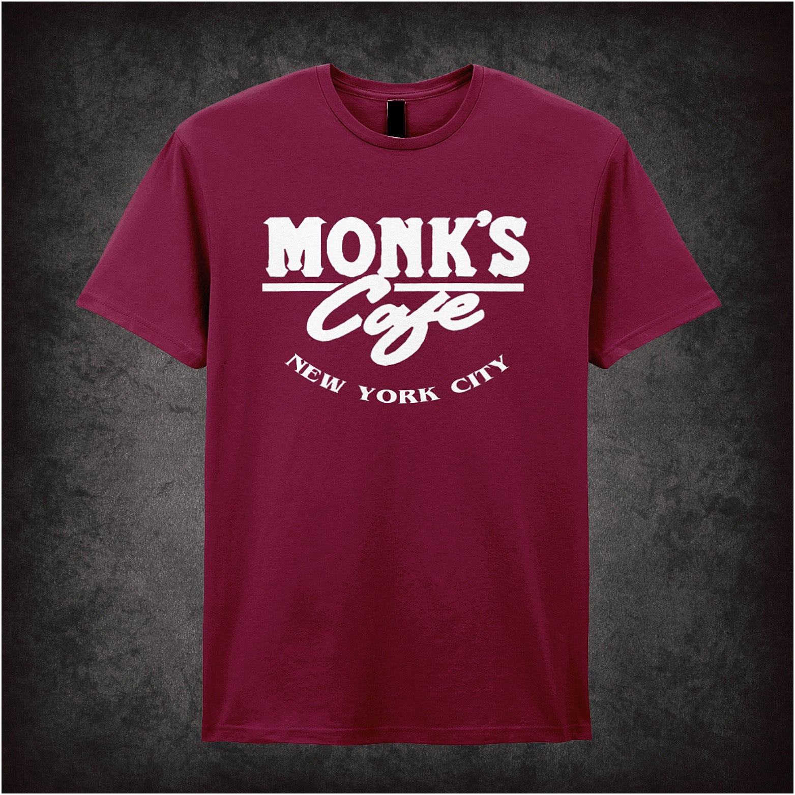 cardinal red unisex T-shirt featuring “Monk's Cafe New York City” design inspired by Seinfeld, with vintage diner-style lettering.