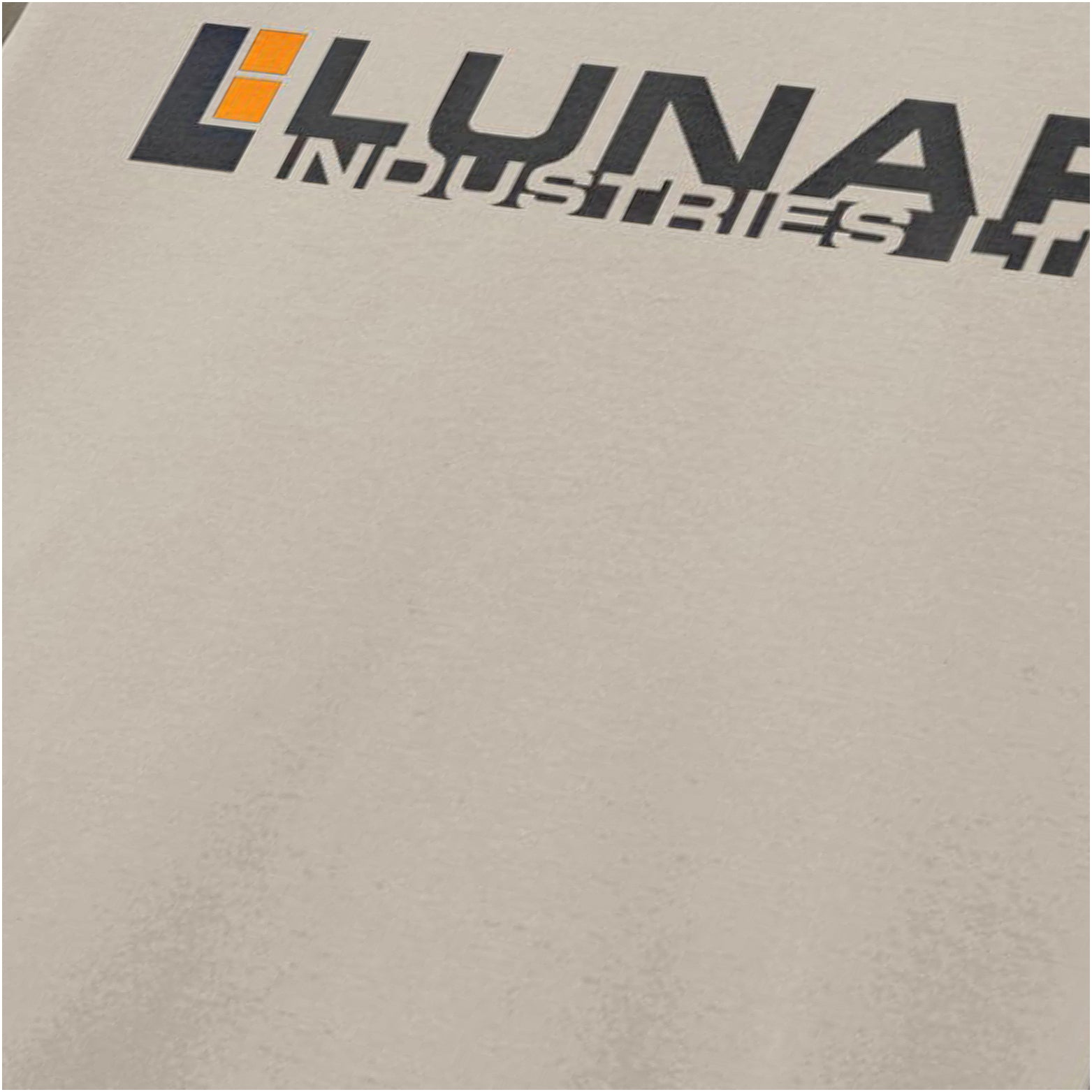 Close-up of lunar Industries logo T-shirt in sand from Moon