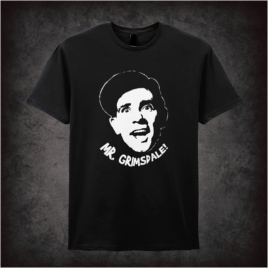 Classic black soft style unisex T-shirt with bold text "Mr. Grimsdale!" inspired by Norman Wisdom, celebrating vintage British comedy charm.