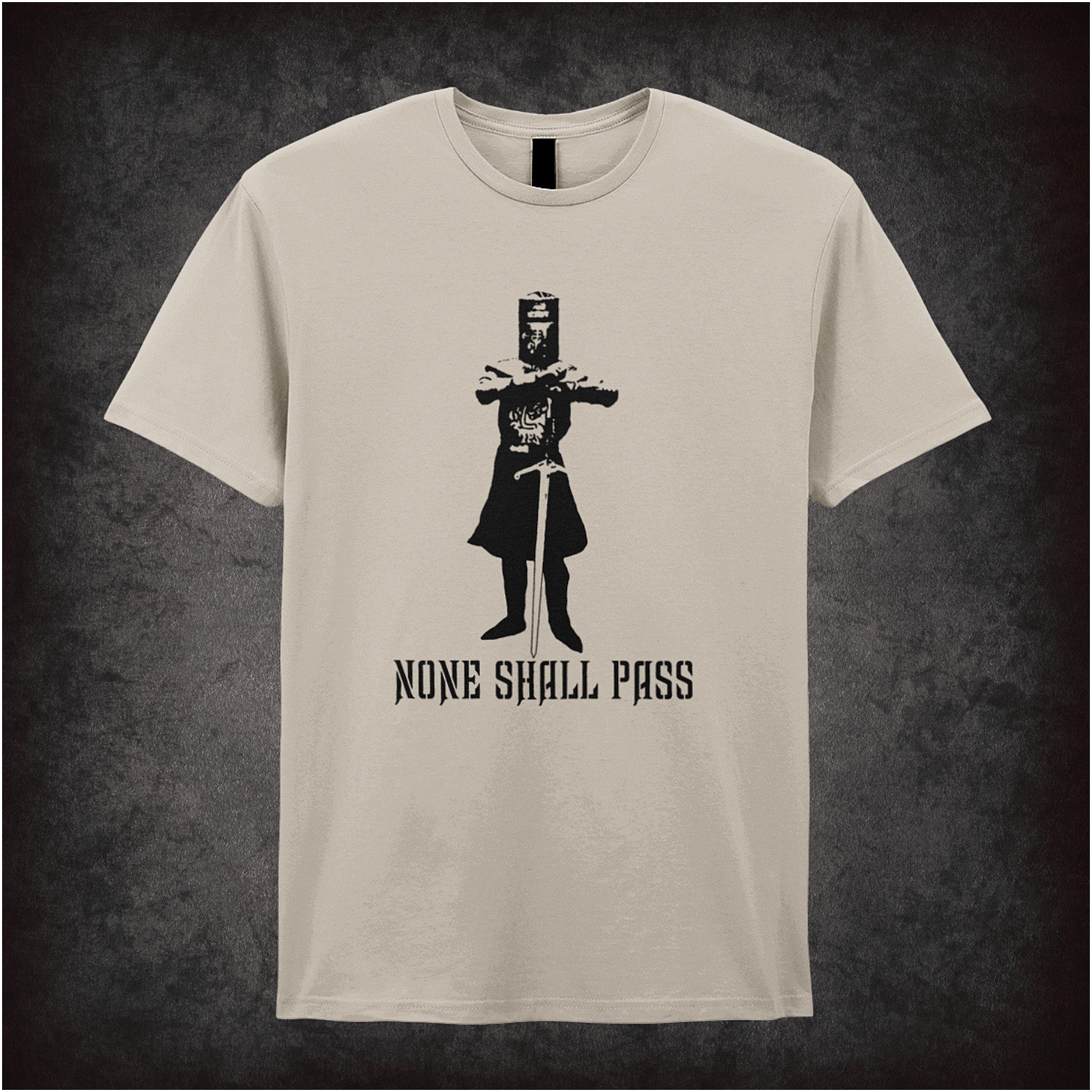 None Shall Pass Monty Python and the Holy Grail inspired soft style sand unisex T-shirt featuring iconic Black Knight quote design, perfect for classic comedy fans.