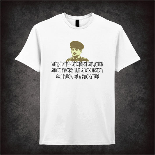 white unisex T-shirt featuring the humorous Blackadder quote 'We're In The Stickiest Situation Since Sticky The Stick Insect Got Stuck On A Sticky Bun' in playful black text.