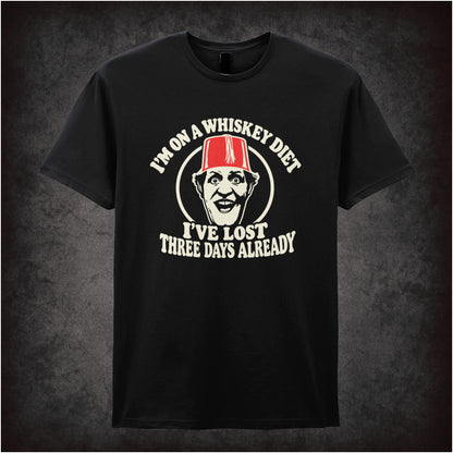 “I’m on a Whiskey Diet, I’ve Lost Three  Days Already” T-shirt in black from Tommy Cooper