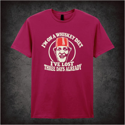 “I’m on a Whiskey Diet, I’ve Lost Three  Days Already” T-shirt in cardinal red from Tommy Cooper