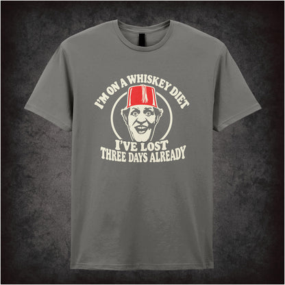 “I’m on a Whiskey Diet, I’ve Lost Three  Days Already” T-shirt in charcoal from Tommy Cooper