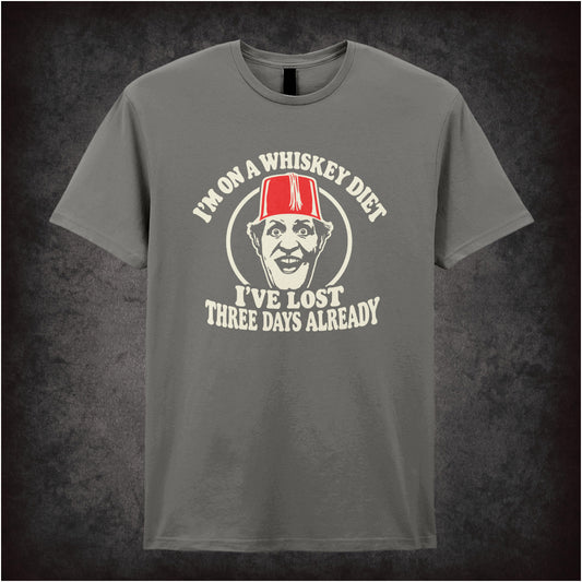 “I’m on a Whiskey Diet, I’ve Lost Three  Days Already” T-shirt in charcoal from Tommy Cooper