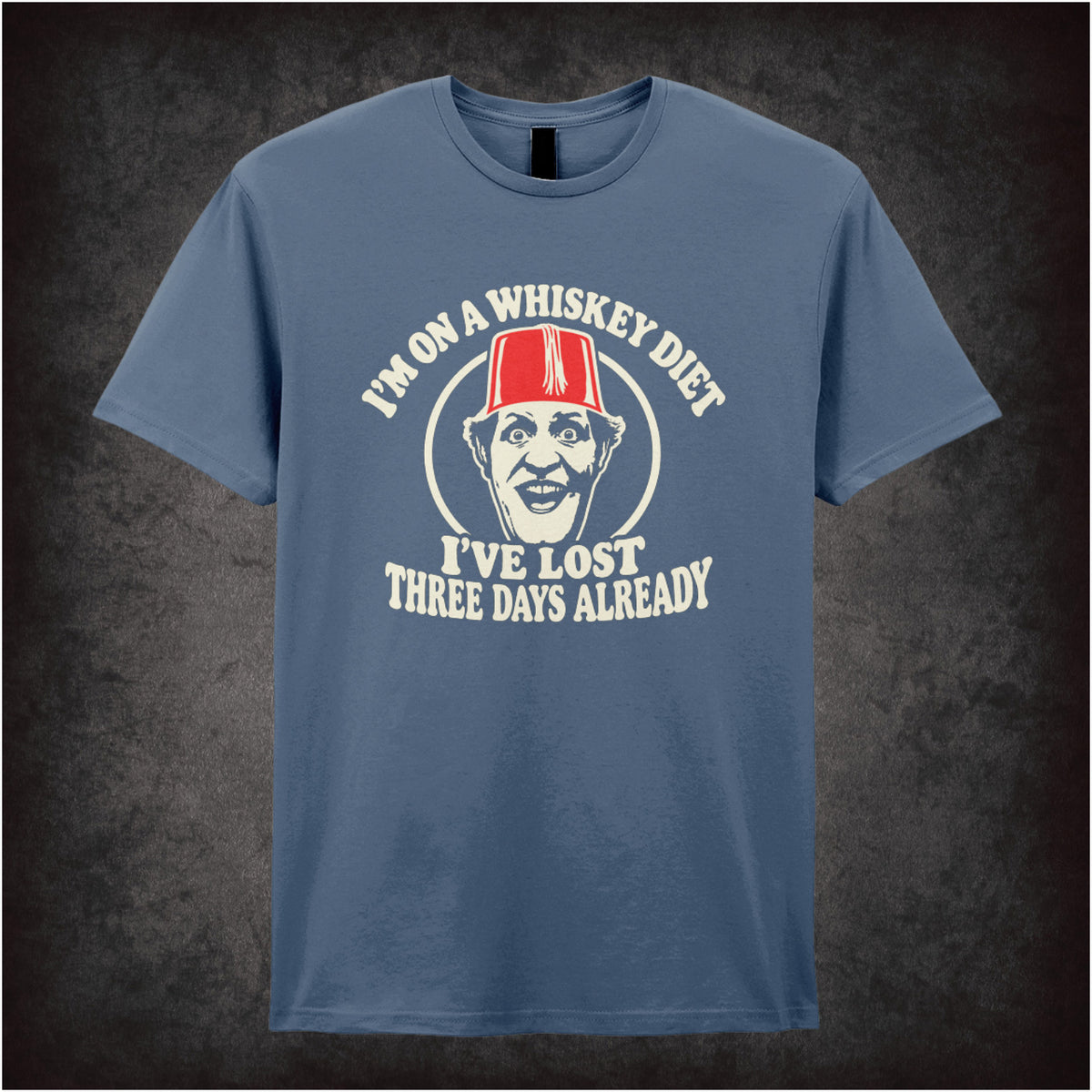 “I’m on a Whiskey Diet, I’ve Lost Three  Days Already” T-shirt in indigo from Tommy Cooper