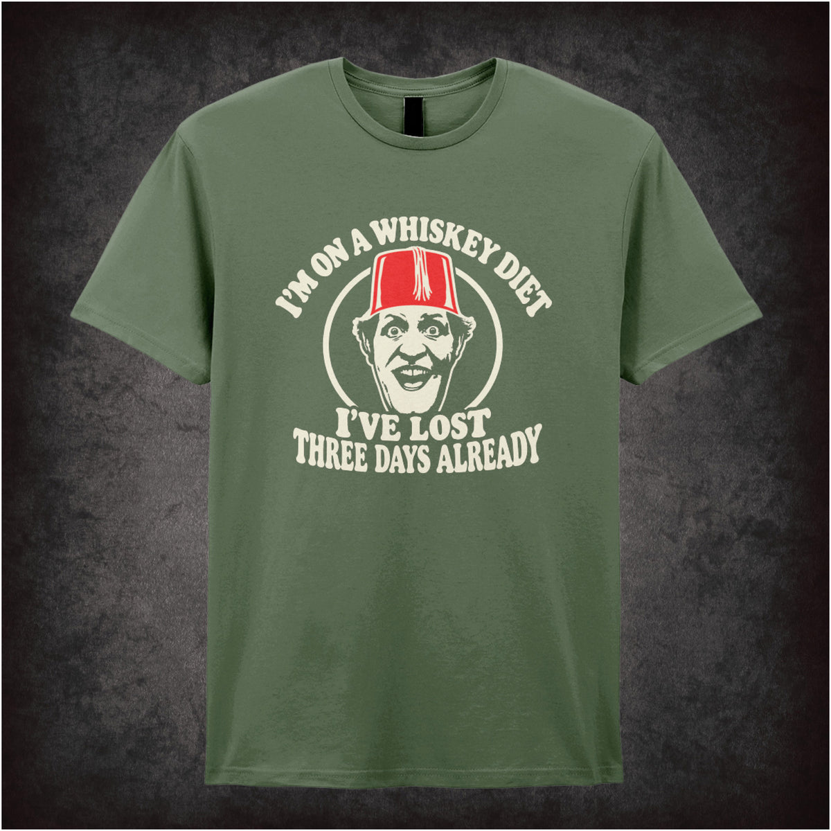 “I’m on a Whiskey Diet, I’ve Lost Three  Days Already” T-shirt in military green from Tommy Cooper