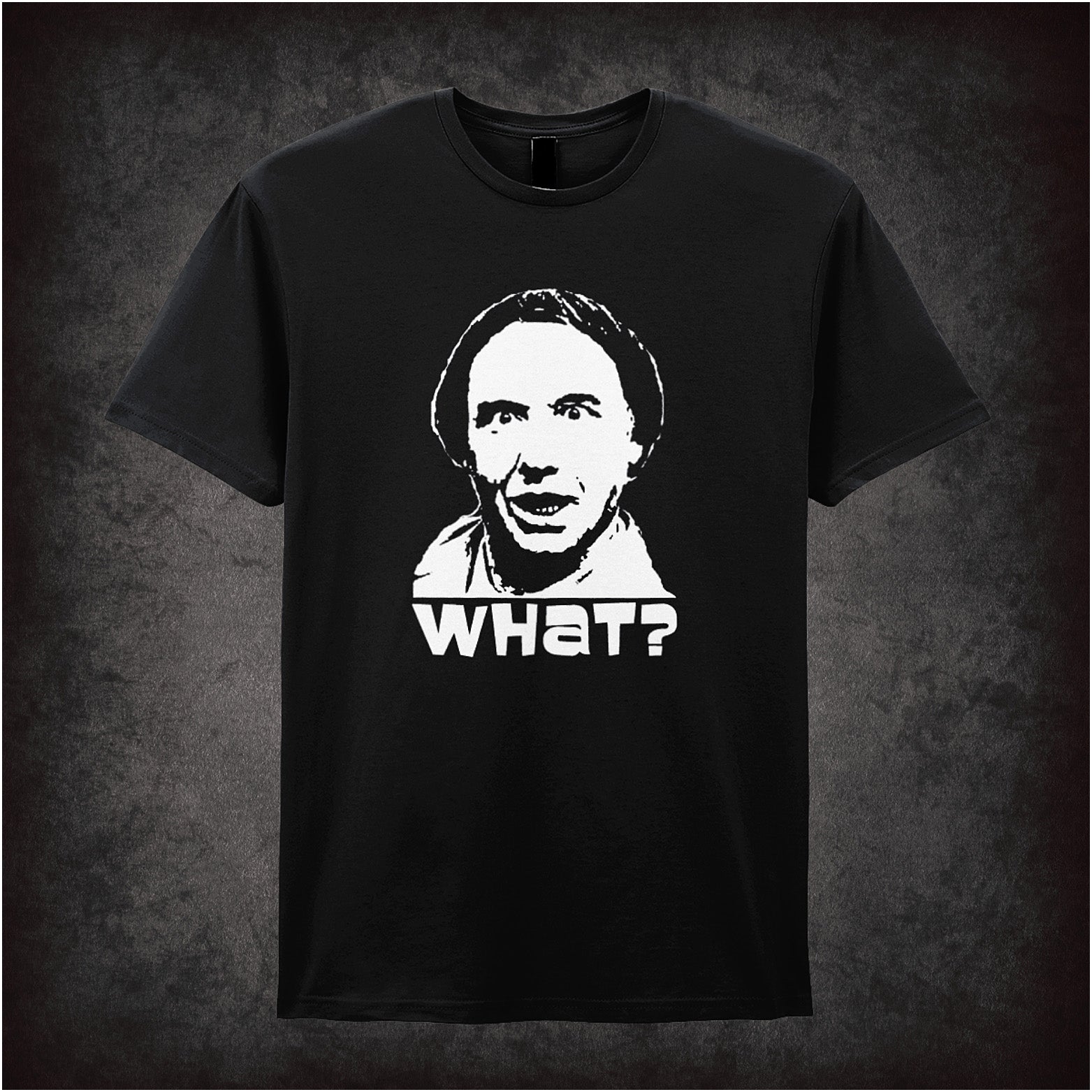 black Soft style unisex T-shirt featuring the bold text "WHAT?" inspired by Vic and Bob, capturing their surreal and offbeat comedy style.