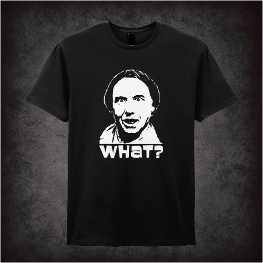 black Soft style unisex T-shirt featuring the bold text "WHAT?" inspired by Vic and Bob, capturing their surreal and offbeat comedy style.