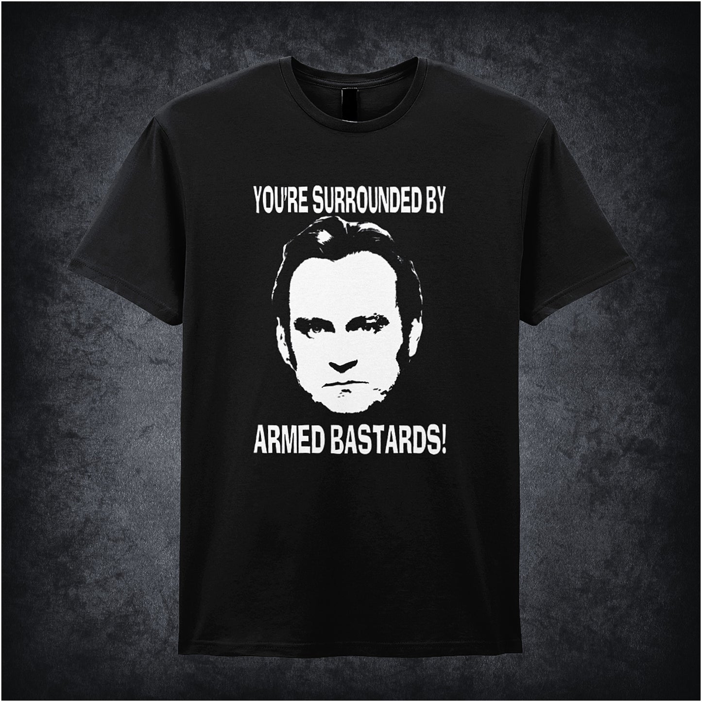 Black soft style unisex T-shirt featuring the quote "You're Surrounded by Armed Bastards!" inspired by Life on Mars, in bold, retro lettering.